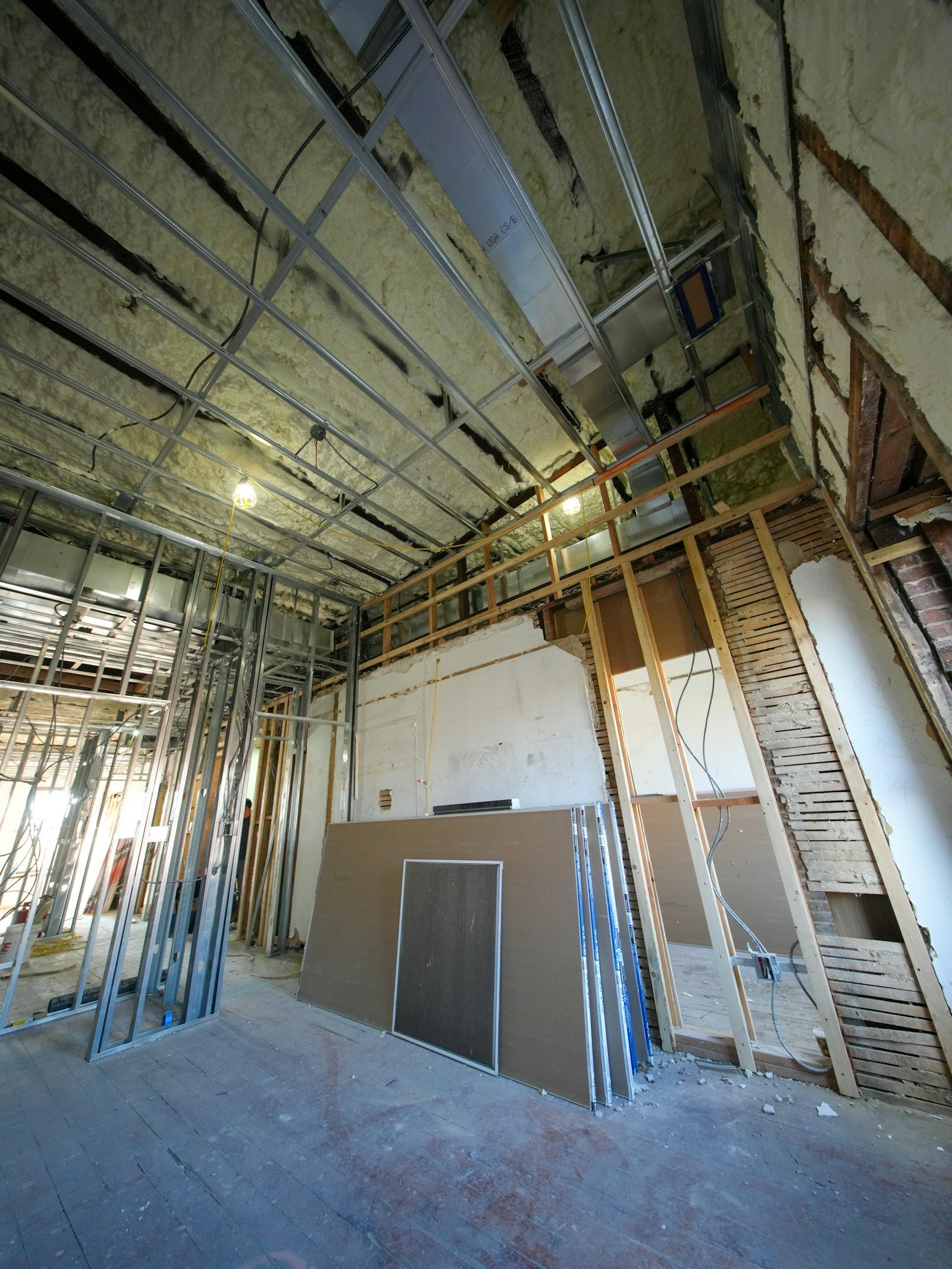 Interior construction with metal studs and drywall sheets